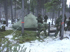 cadet in forest with tents
