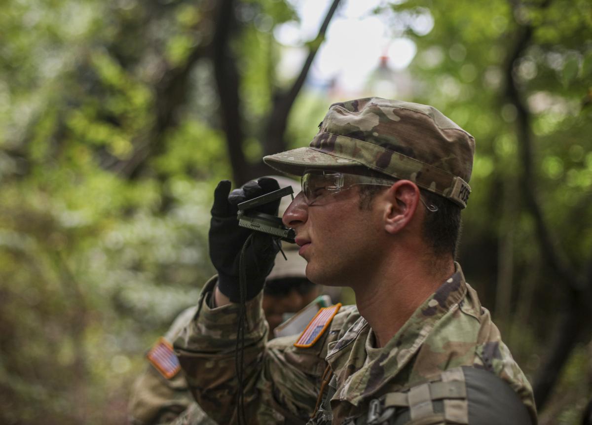 cadet in forest holding device