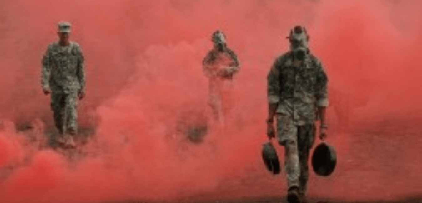 soldiers walk in red haze